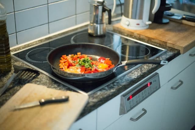Cook top with peppers in a sauce pan.