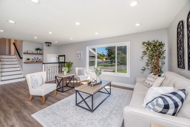 A beautifully decorated living room with absolutely no clutter and just a few specially placed decorations. Definitely looks show ready.