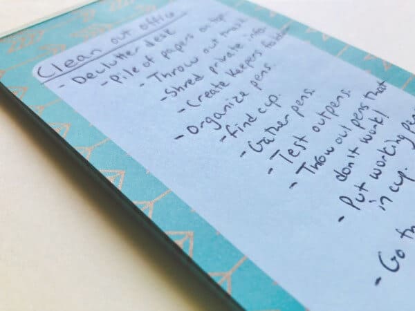 Notepad with list of things to do to clean out the office. | motivation to declutter