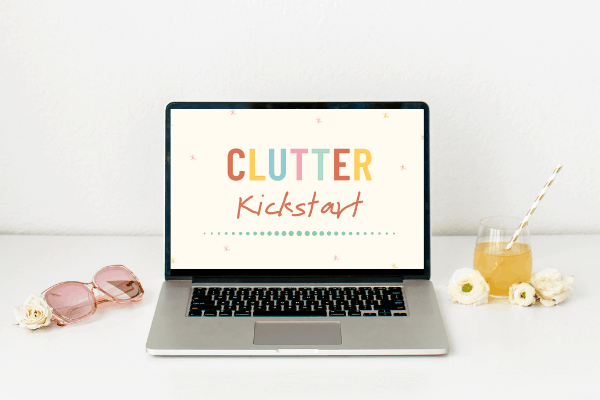 Laptop with the Clutter Kickstart logo on it.