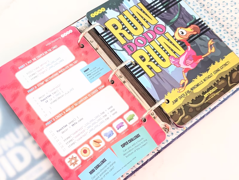 Binder open to a page of a coding activity for kids from Bitsbox. This is an example of a clutter-free gift idea for kids.